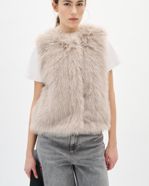 Faux fur vest features a regular fit, sleeveless cut, and round neckline. Perfect for layering, this piece offers a cozy feel and stylish silhouette for versatile outfits.